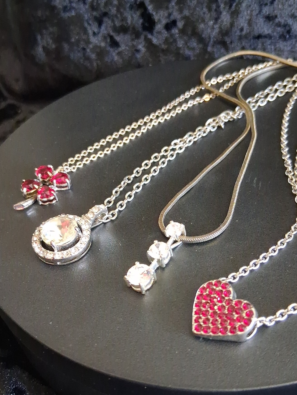 Avon Silver-Tone Necklace Trio with Red Crystal Heart and Red Clover Flower.